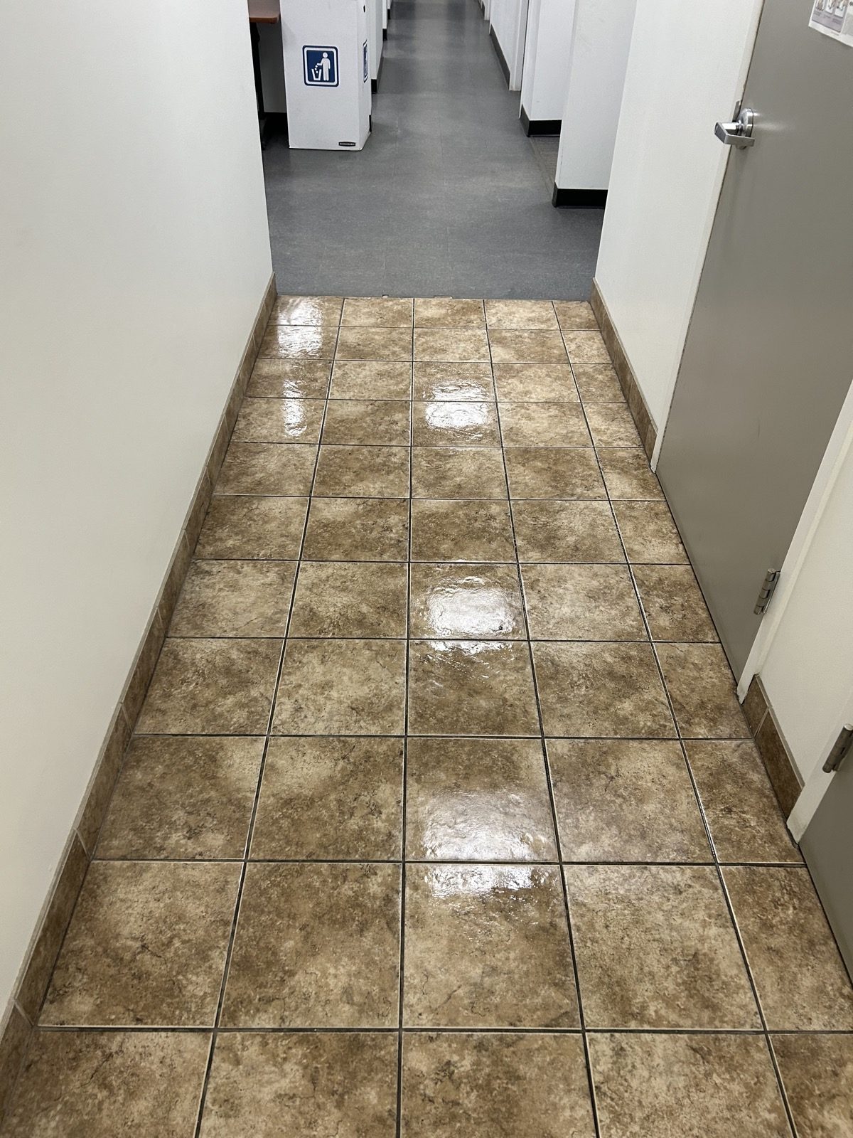 Freshly cleaned restroom hallway tile